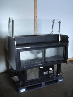 Barker sushi deli cold case with prep counter behind 